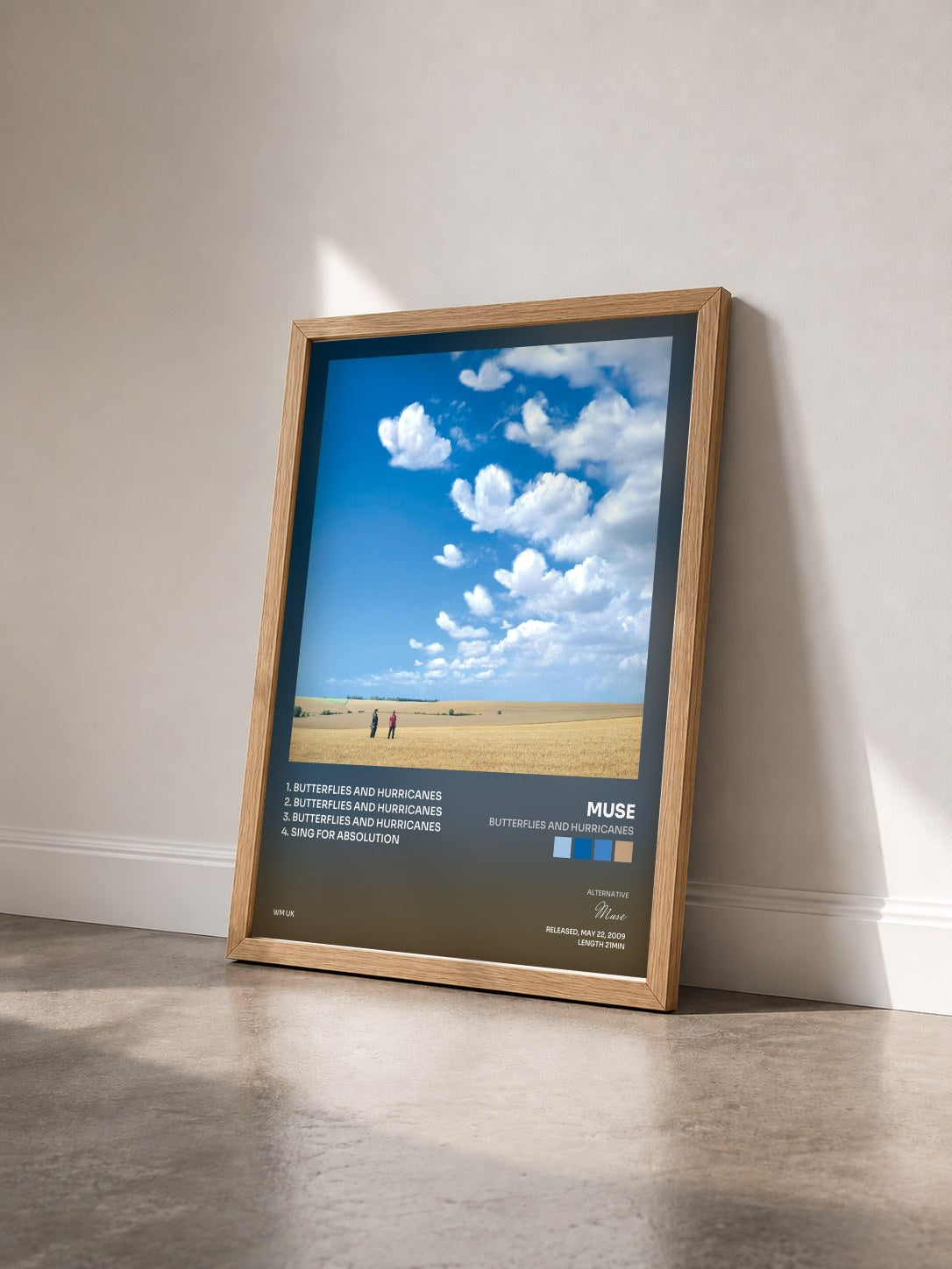 #bois Tableau de l'album Butterflies and Hurricanes de Muse vu de trois quarts, cadre en bois brut