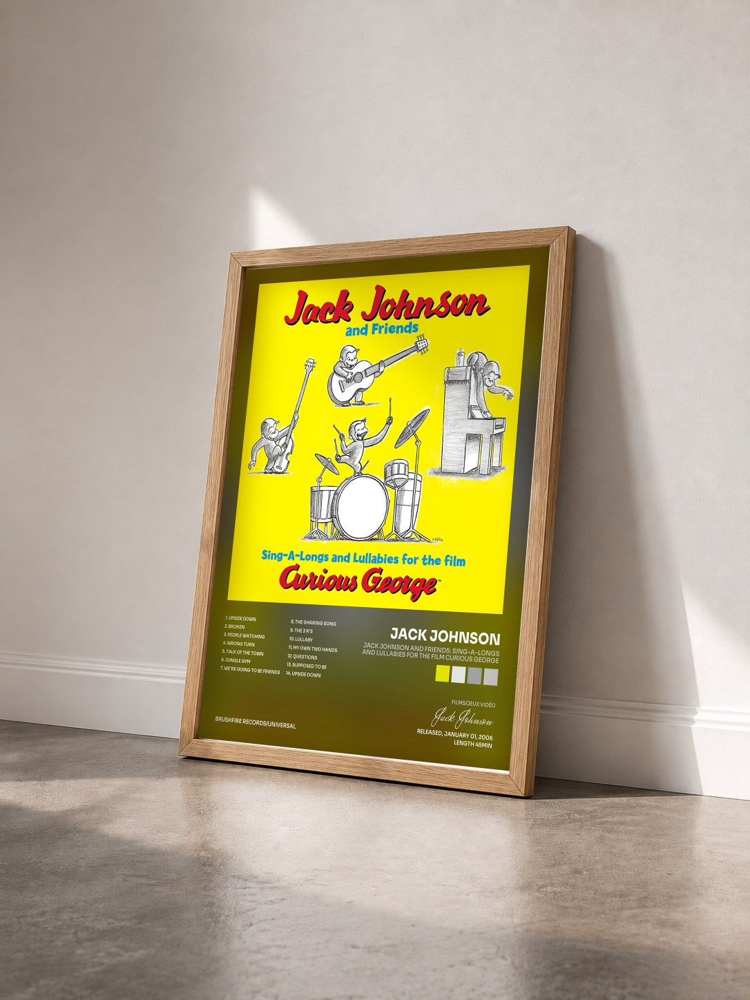 #bois Tableau de l'album Jack Johnson And Friends: Sing-A-Longs And Lullabies For The Film Curious George de Jack Johnson vu de trois quarts, cadre en bois brut