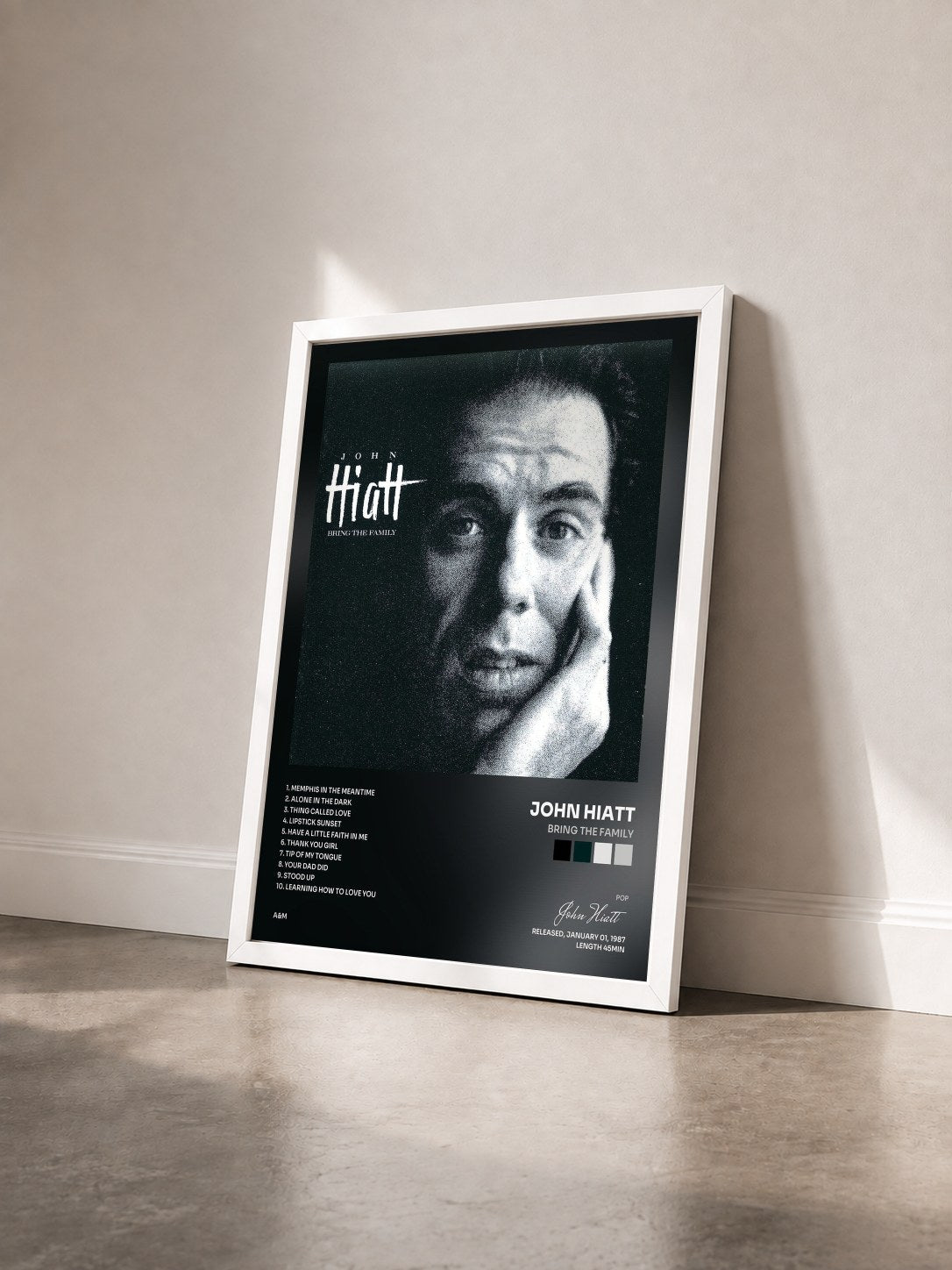 #blanc Tableau de l'album Bring The Family de John Hiatt vu de trois quarts, cadre blanc