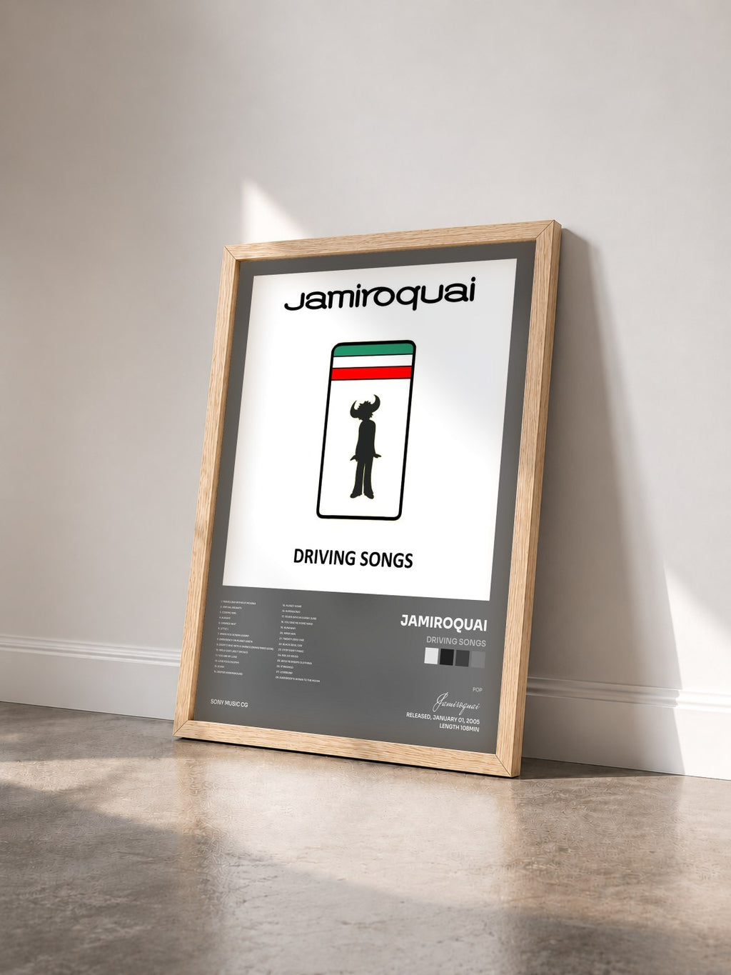 #bois Tableau de l'album Driving Songs de Jamiroquai vu de trois quarts, cadre en bois brut