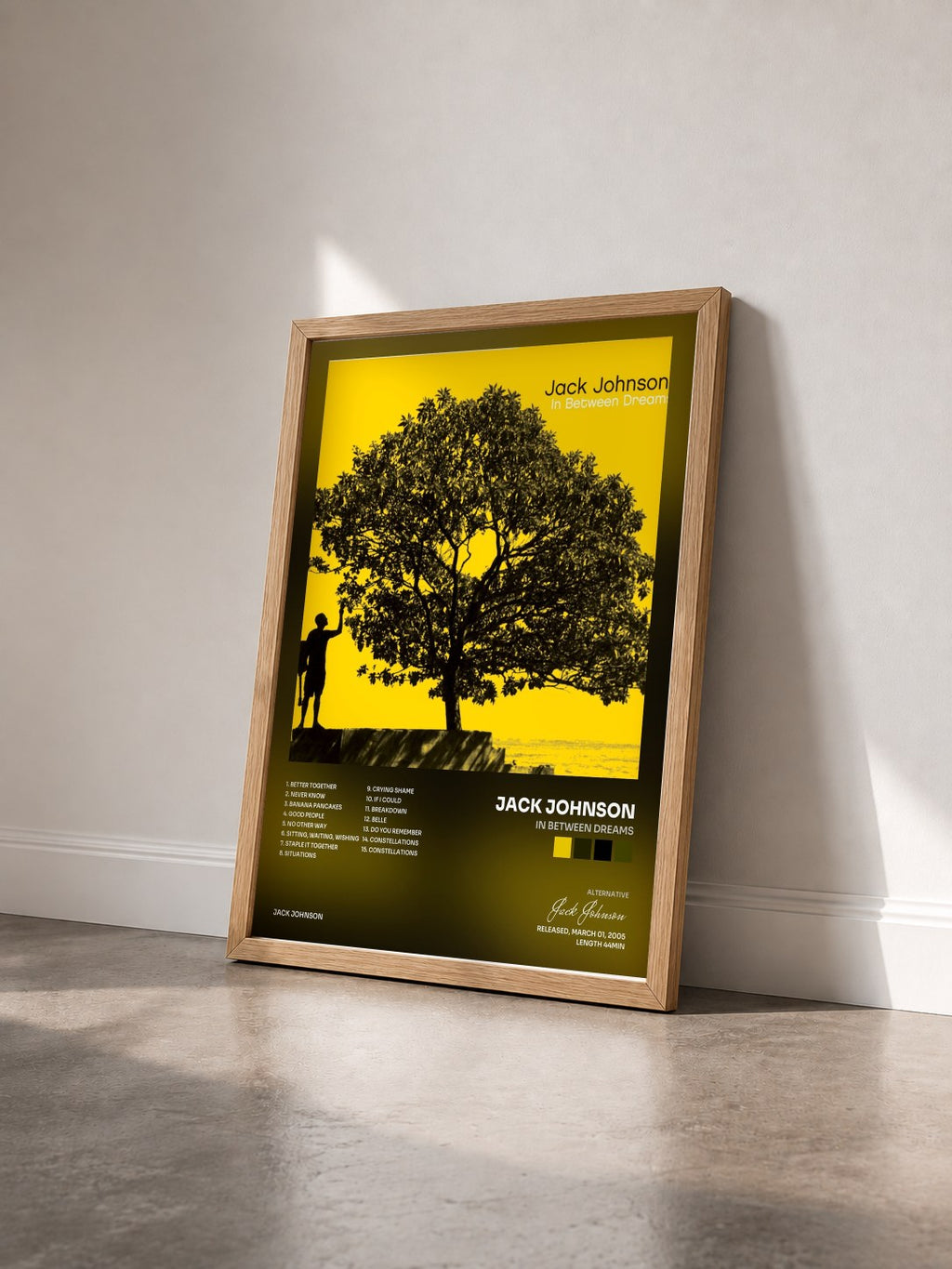 #bois Tableau de l'album In Between Dreams de Jack Johnson vu de trois quarts, cadre en bois brut