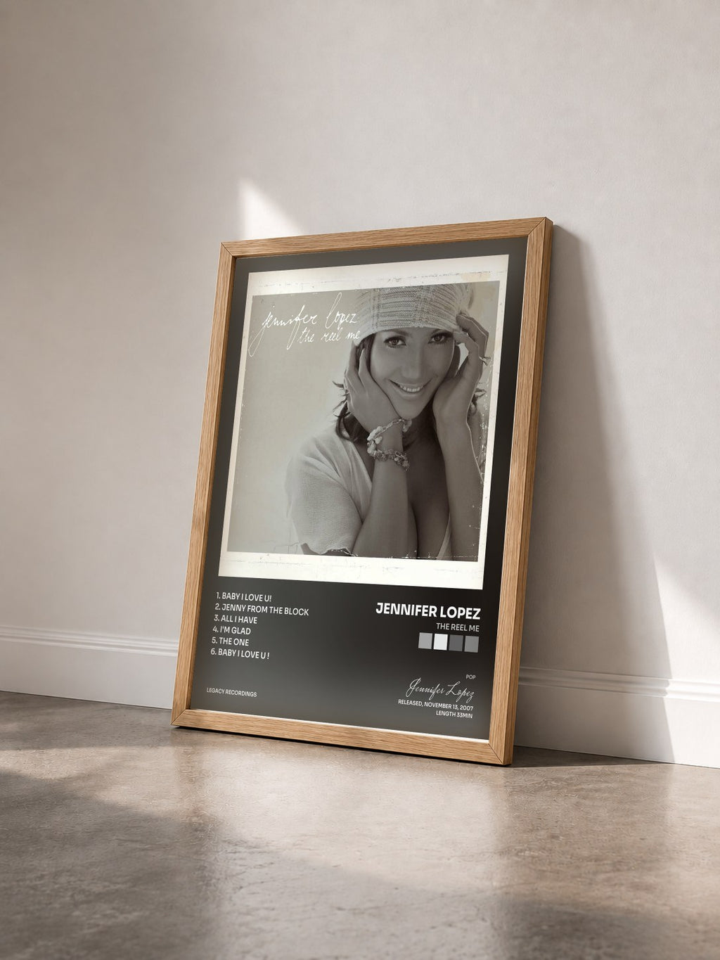 #bois Tableau de l'album The Reel Me de Jennifer Lopez vu de trois quarts, cadre en bois brut