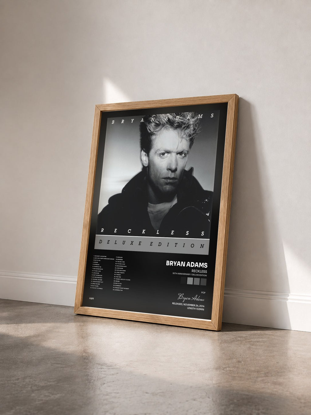 #bois Tableau de l'album Reckless (30th Anniversary / Deluxe Edition) de Bryan Adams vu de trois quarts, cadre en bois brut