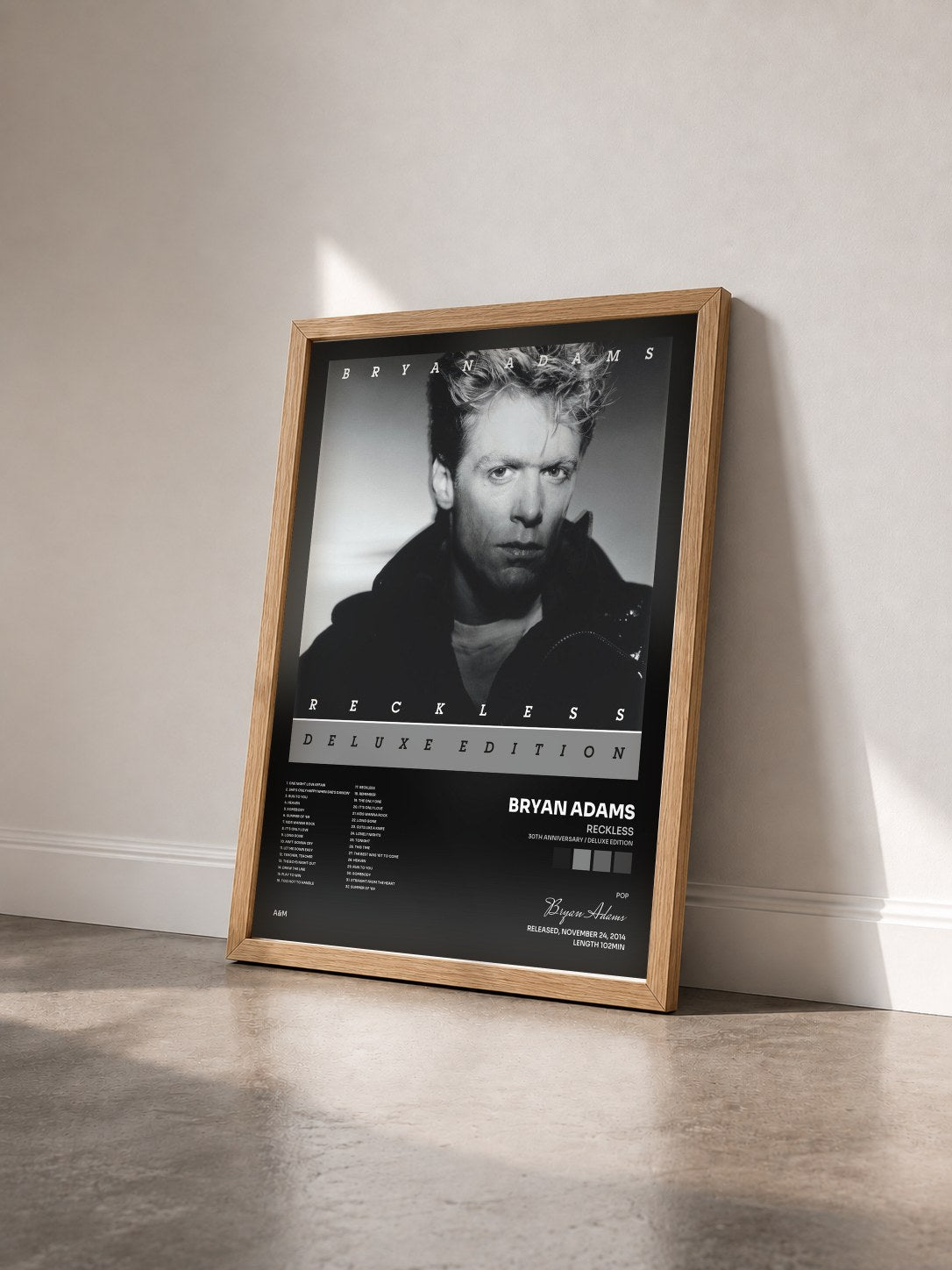 #bois Tableau de l'album Reckless (30th Anniversary / Deluxe Edition) de Bryan Adams vu de trois quarts, cadre en bois brut