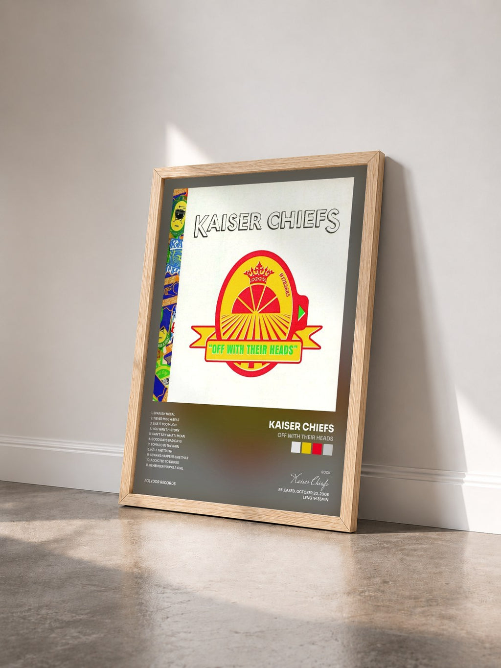 #bois Tableau de l'album Off With Their Heads de Kaiser Chiefs vu de trois quarts, cadre en bois brut