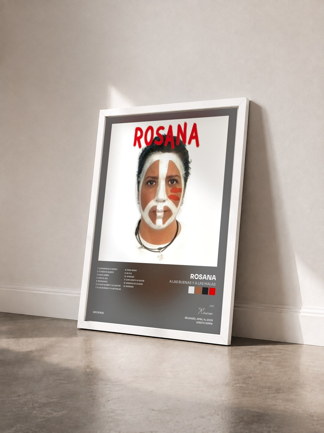 #blanc Tableau de l'album A las buenas y a las malas de Rosana vu de trois quarts, cadre blanc