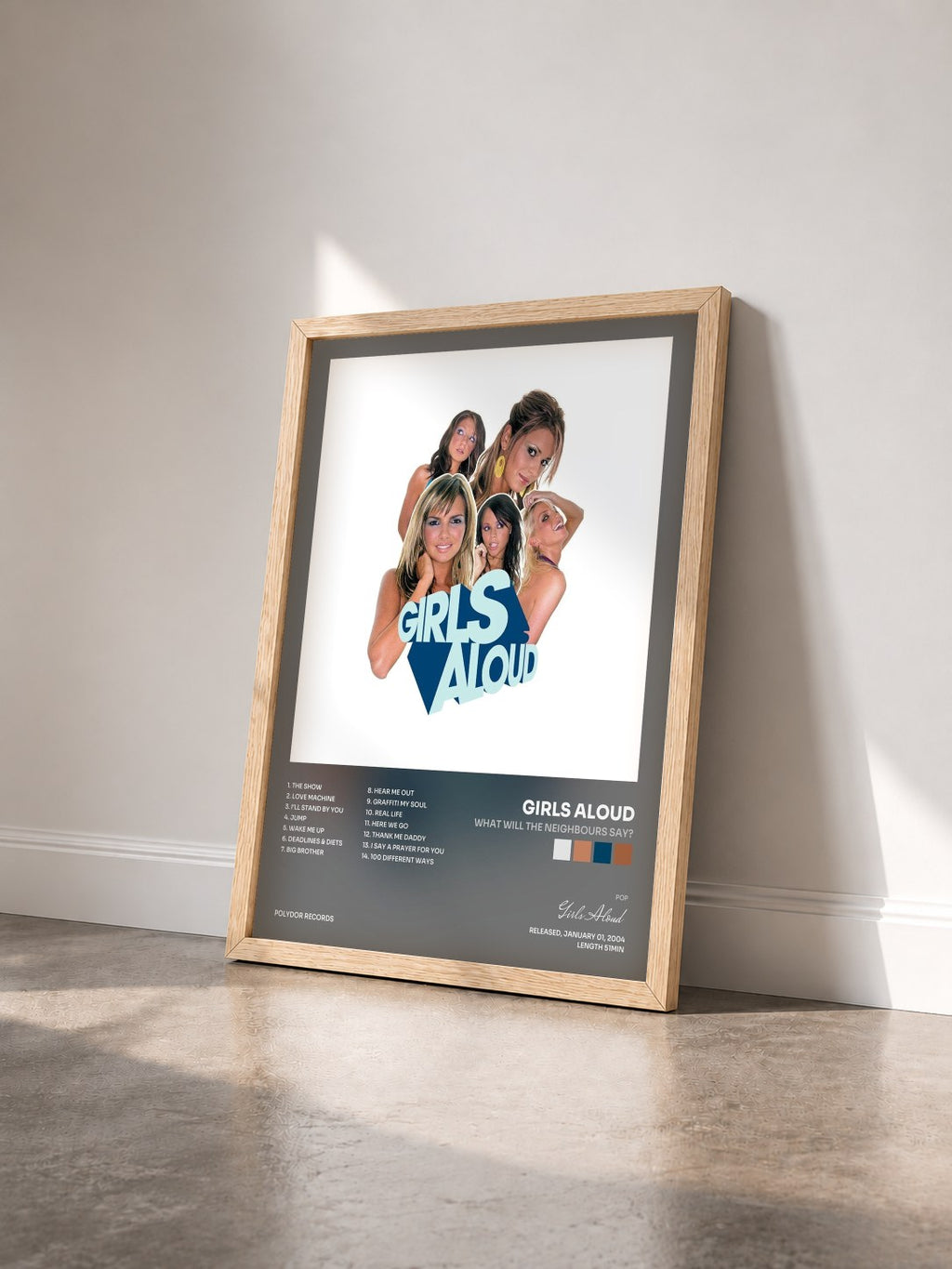 #bois Tableau de l'album What Will The Neighbours Say? de Girls Aloud vu de trois quarts, cadre en bois brut
