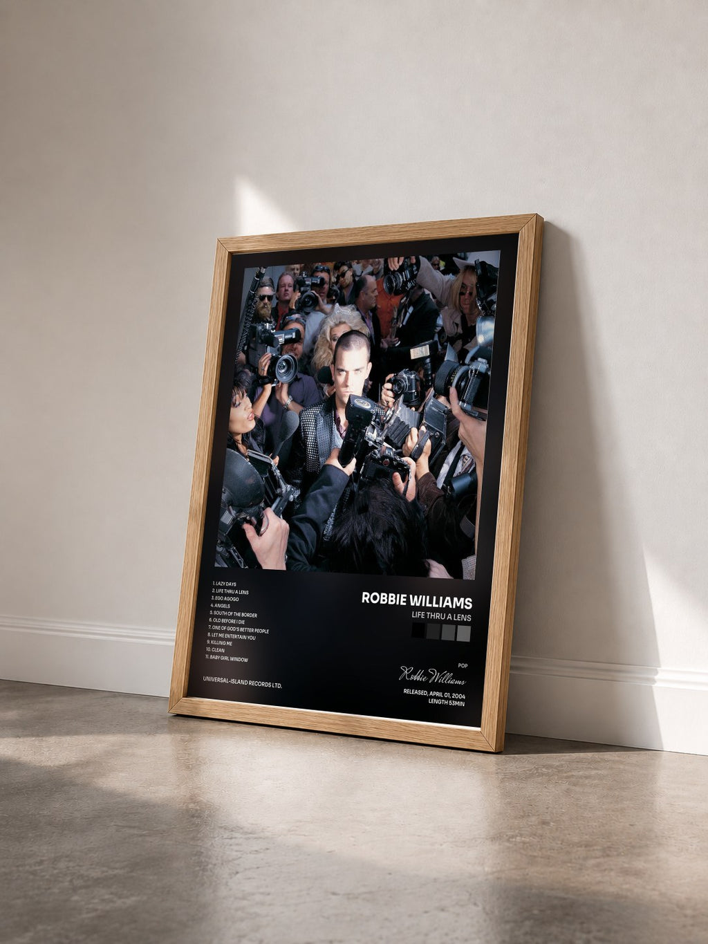 #bois Tableau de l'album Life Thru A Lens de Robbie Williams vu de trois quarts, cadre en bois brut