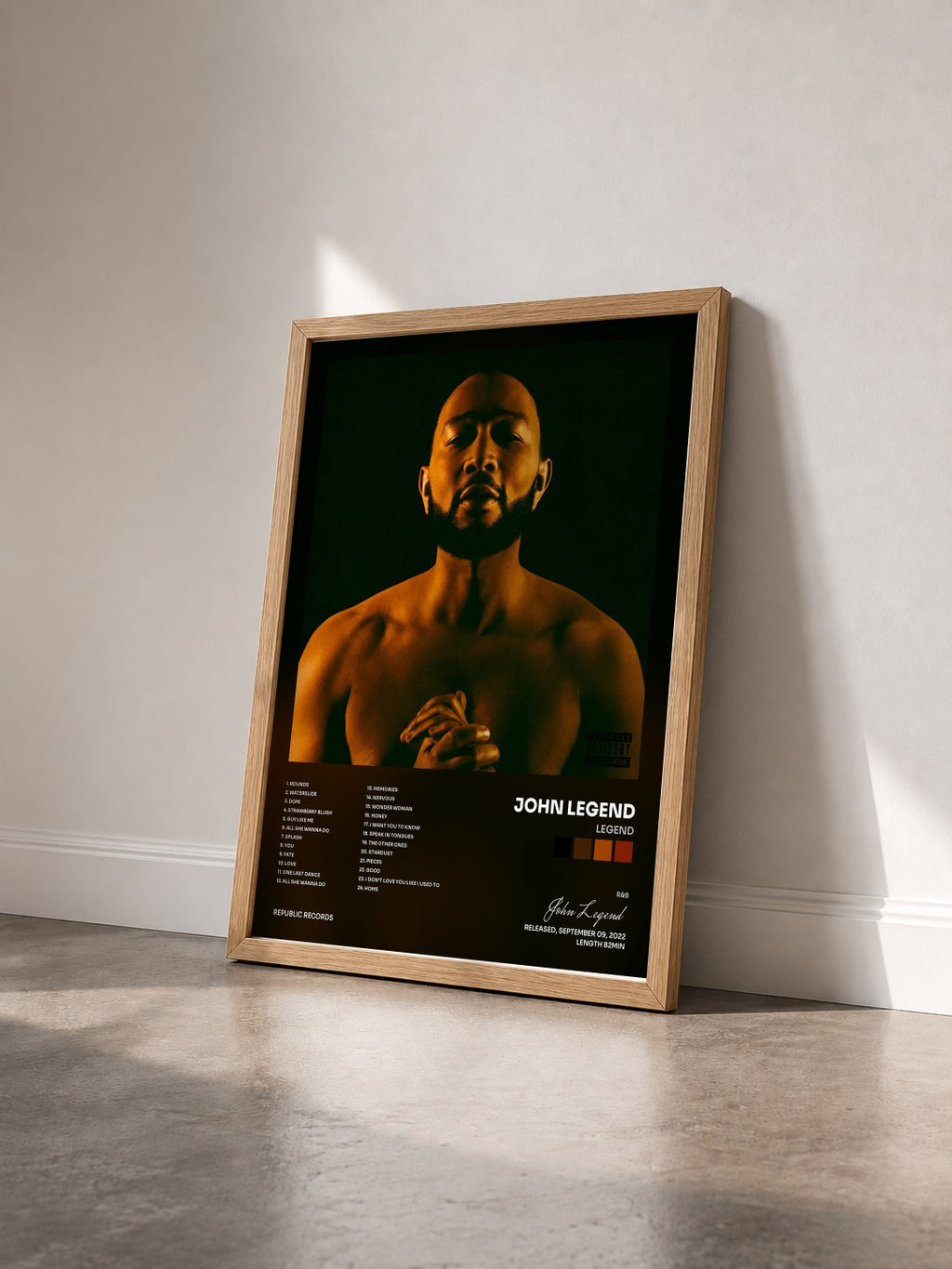 #bois Tableau de l'album LEGEND de John Legend vu de trois quarts, cadre en bois brut