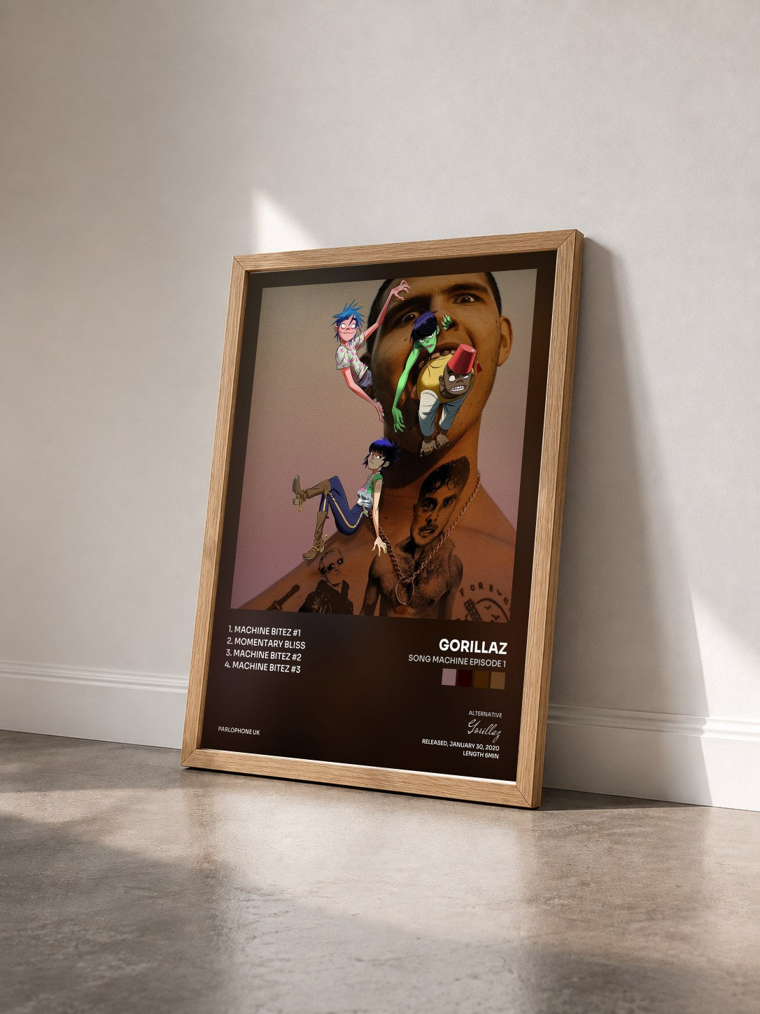 #bois Tableau de l'album Song Machine Episode 1 de Gorillaz vu de trois quarts, cadre en bois brut