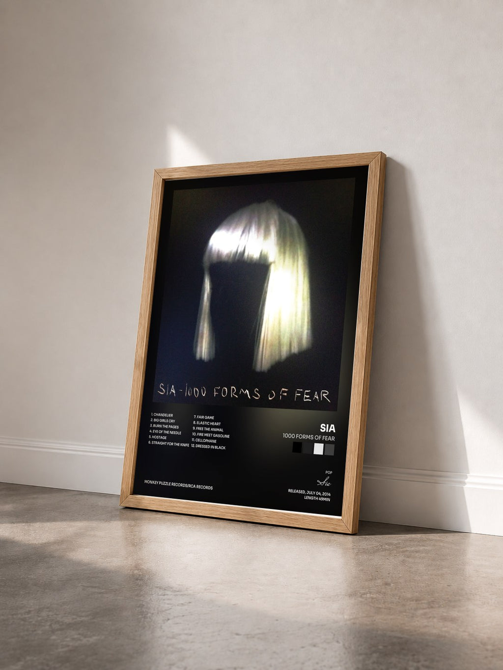 #bois Tableau de l'album 1000 Forms Of Fear de Sia vu de trois quarts, cadre en bois brut