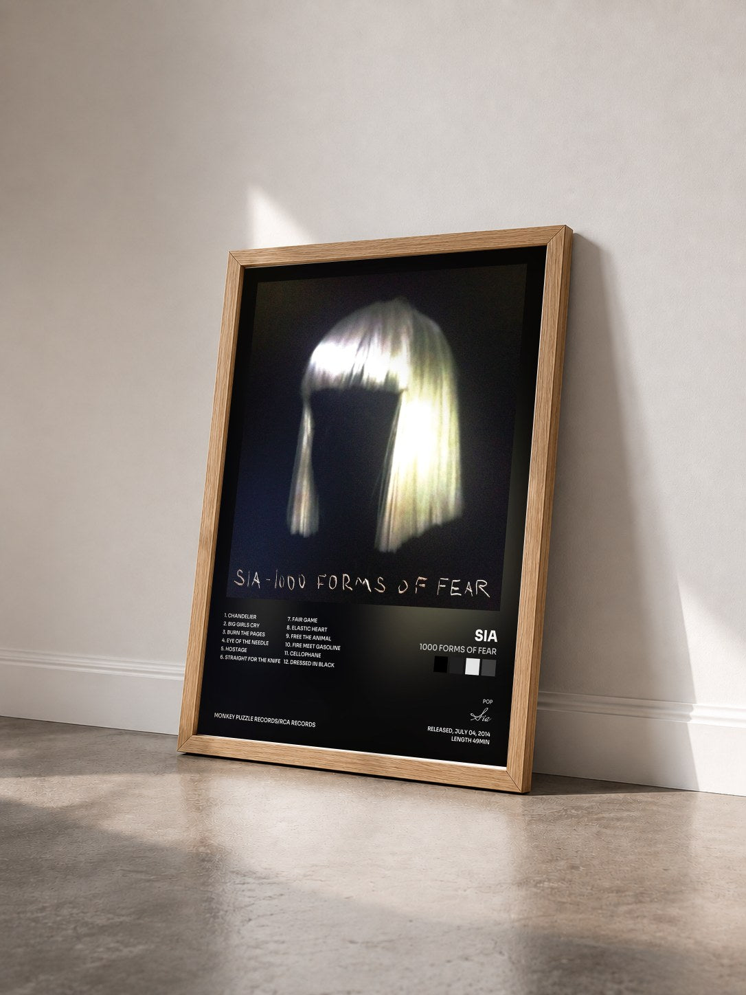 #bois Tableau de l'album 1000 Forms Of Fear de Sia vu de trois quarts, cadre en bois brut