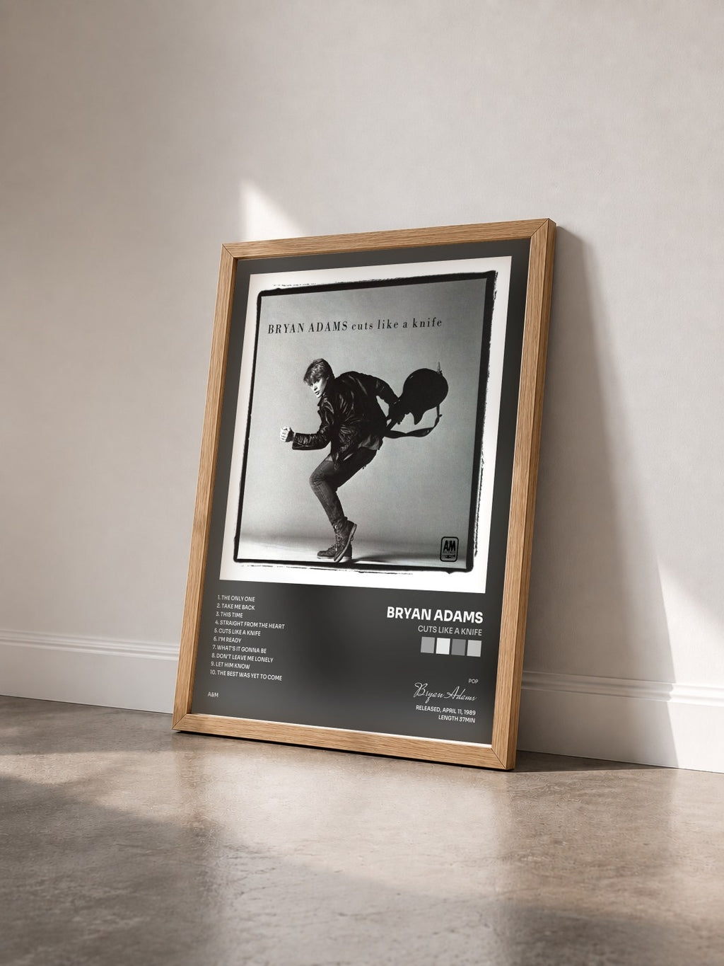 #bois Tableau de l'album Cuts Like A Knife de Bryan Adams vu de trois quarts, cadre en bois brut
