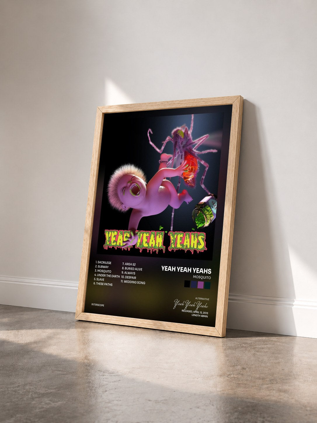 #bois Tableau de l'album Mosquito de Yeah Yeah Yeahs vu de trois quarts, cadre en bois brut