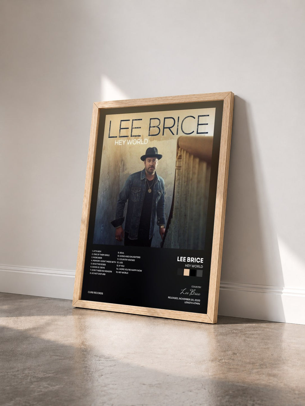 #bois Tableau de l'album Hey World de Lee Brice vu de trois quarts, cadre en bois brut
