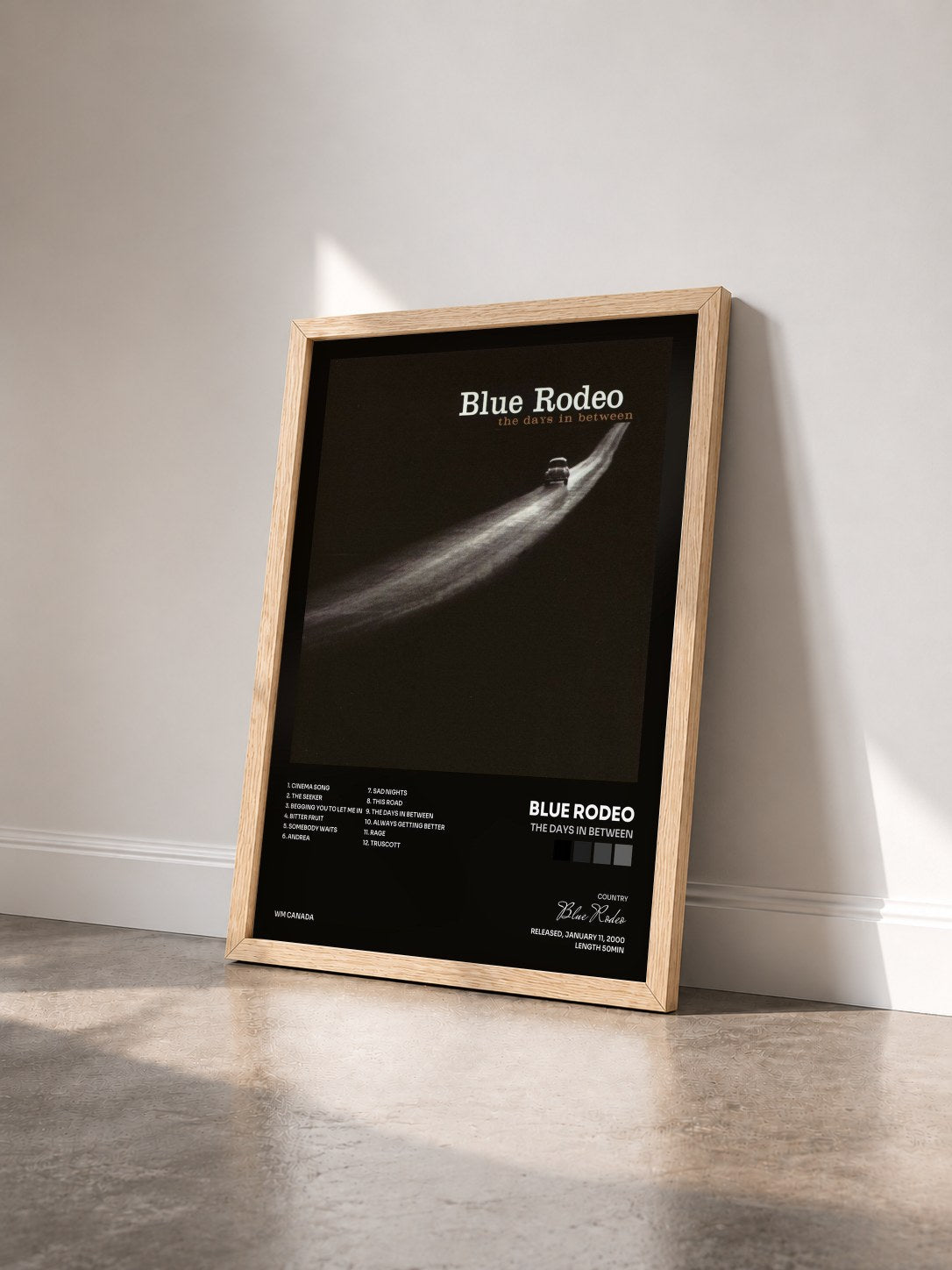 #bois Tableau de l'album The Days in Between de Blue Rodeo vu de trois quarts, cadre en bois brut