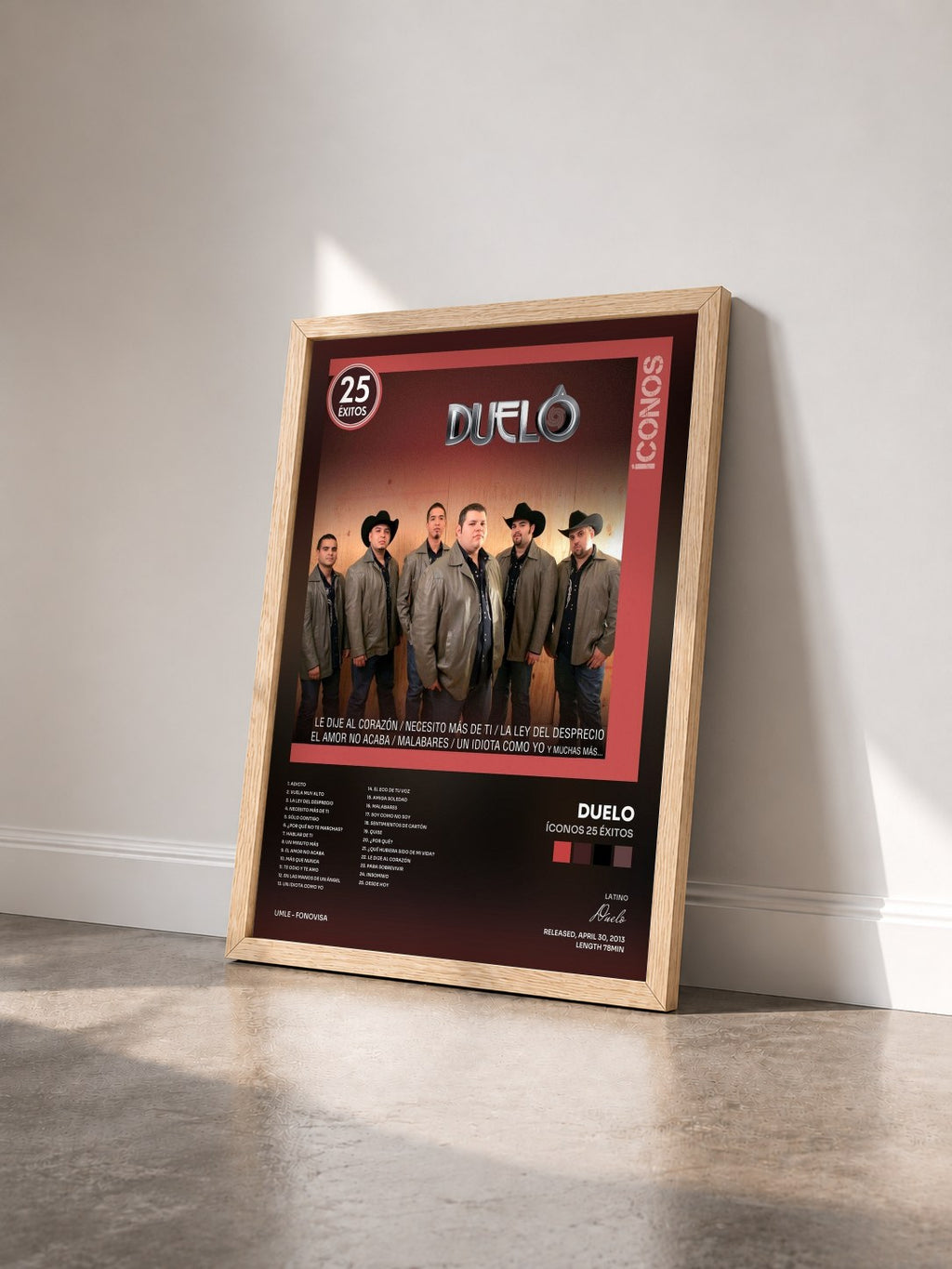 #bois Tableau de l'album Íconos 25 Éxitos de Duelo vu de trois quarts, cadre en bois brut