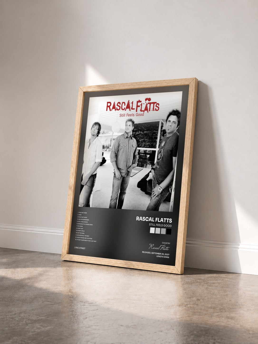 #bois Tableau de l'album Still Feels Good de Rascal Flatts vu de trois quarts, cadre en bois brut
