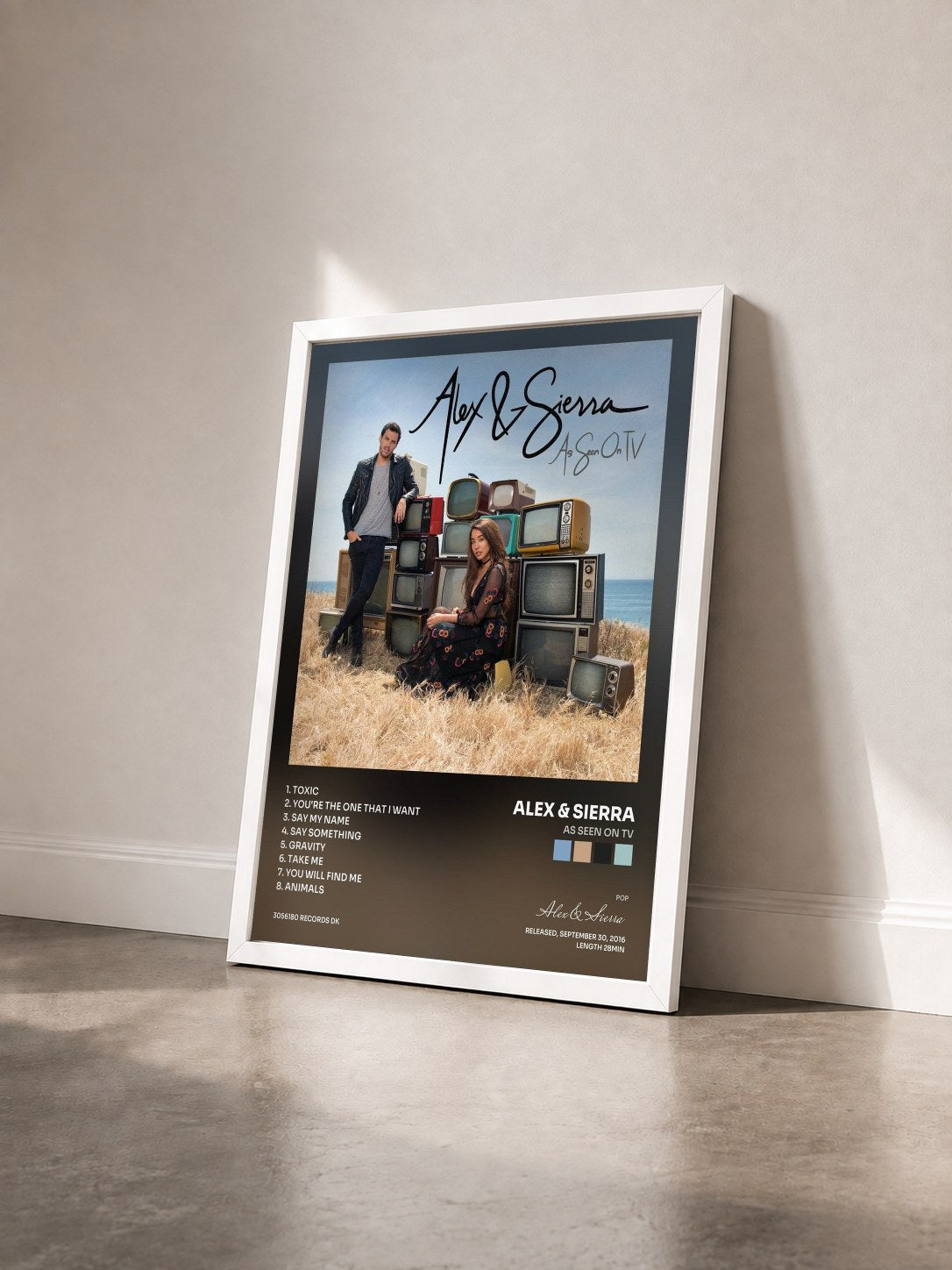 #blanc Tableau de l'album As Seen On TV de Alex & Sierra vu de trois quarts, cadre blanc