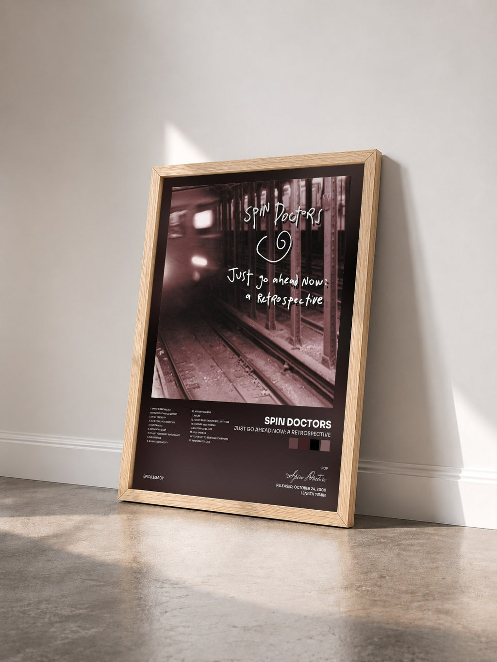 #bois Tableau de l'album Just Go Ahead Now: A Retrospective de Spin Doctors vu de trois quarts, cadre en bois brut