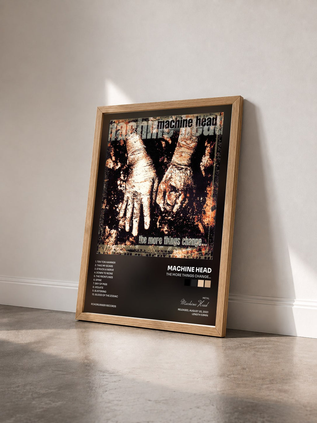 #bois Tableau de l'album The More Things Change... de Machine Head vu de trois quarts, cadre en bois brut