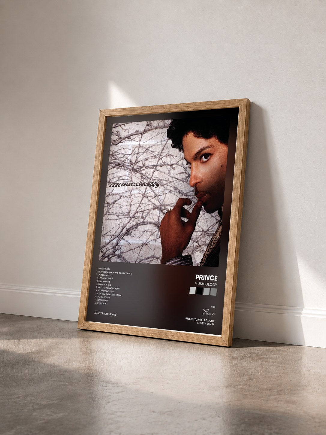 #bois Tableau de l'album Musicology de Prince vu de trois quarts, cadre en bois brut