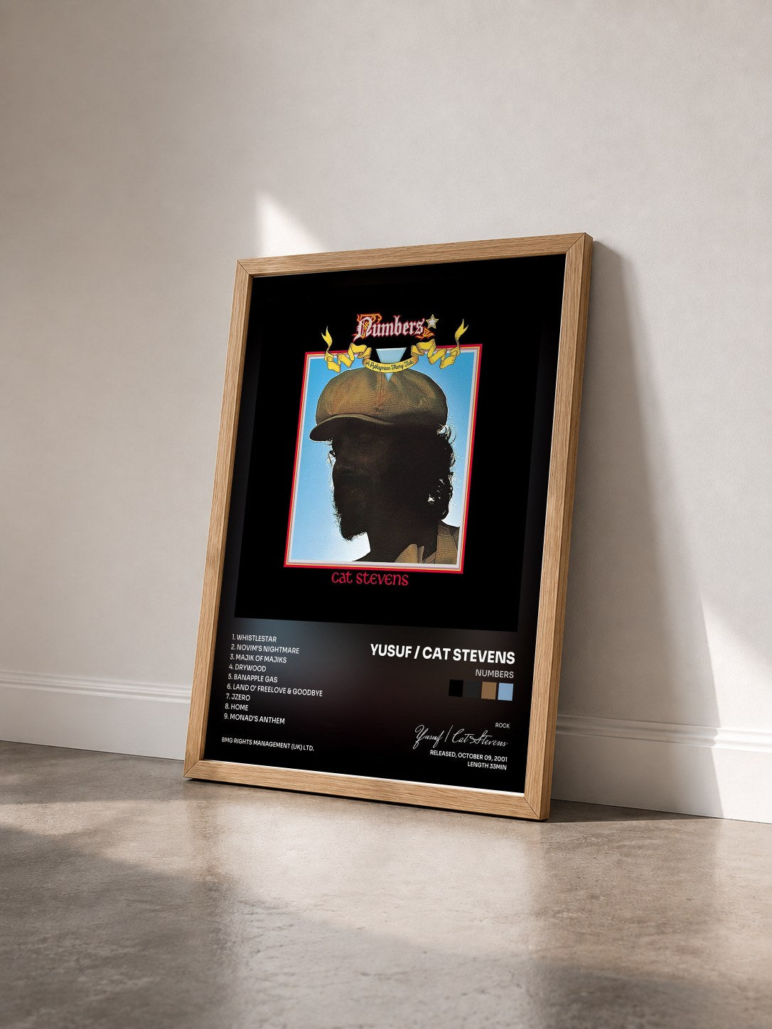 #bois Tableau de l'album Numbers de Yusuf / Cat Stevens vu de trois quarts, cadre en bois brut