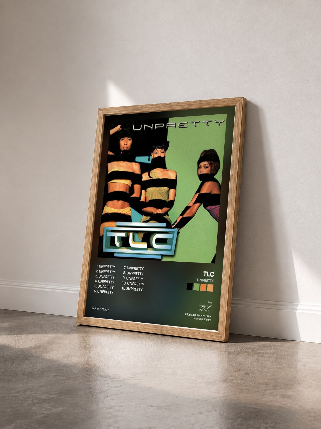 #bois Tableau de l'album Unpretty de TLC vu de trois quarts, cadre en bois brut