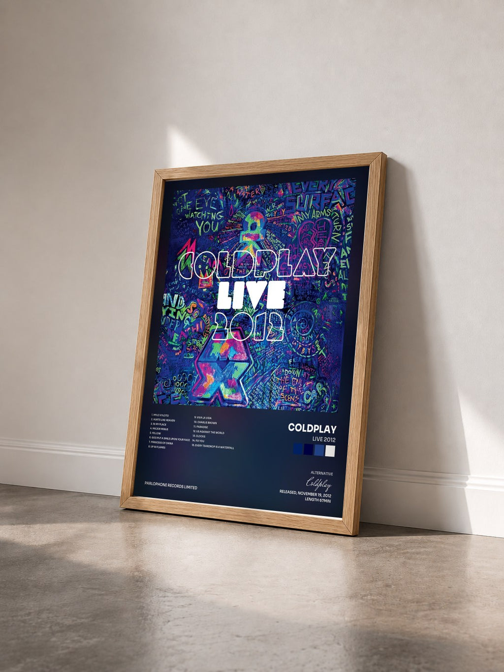 #bois Tableau de l'album Live 2012 de Coldplay vu de trois quarts, cadre en bois brut