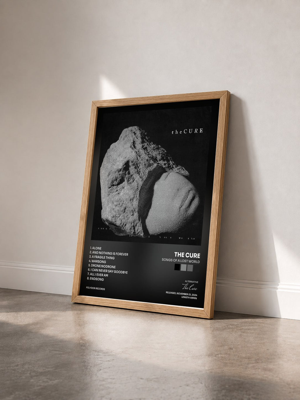 #bois Tableau de l'album Songs Of A Lost World de The Cure vu de trois quarts, cadre en bois brut