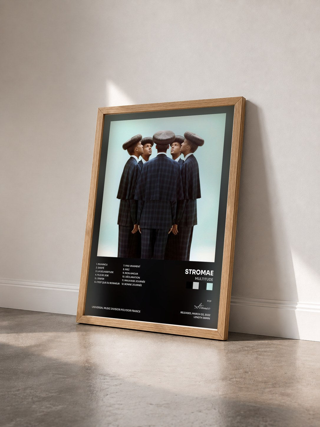 #bois Tableau de l'album Multitude de Stromae vu de trois quarts, cadre en bois brut