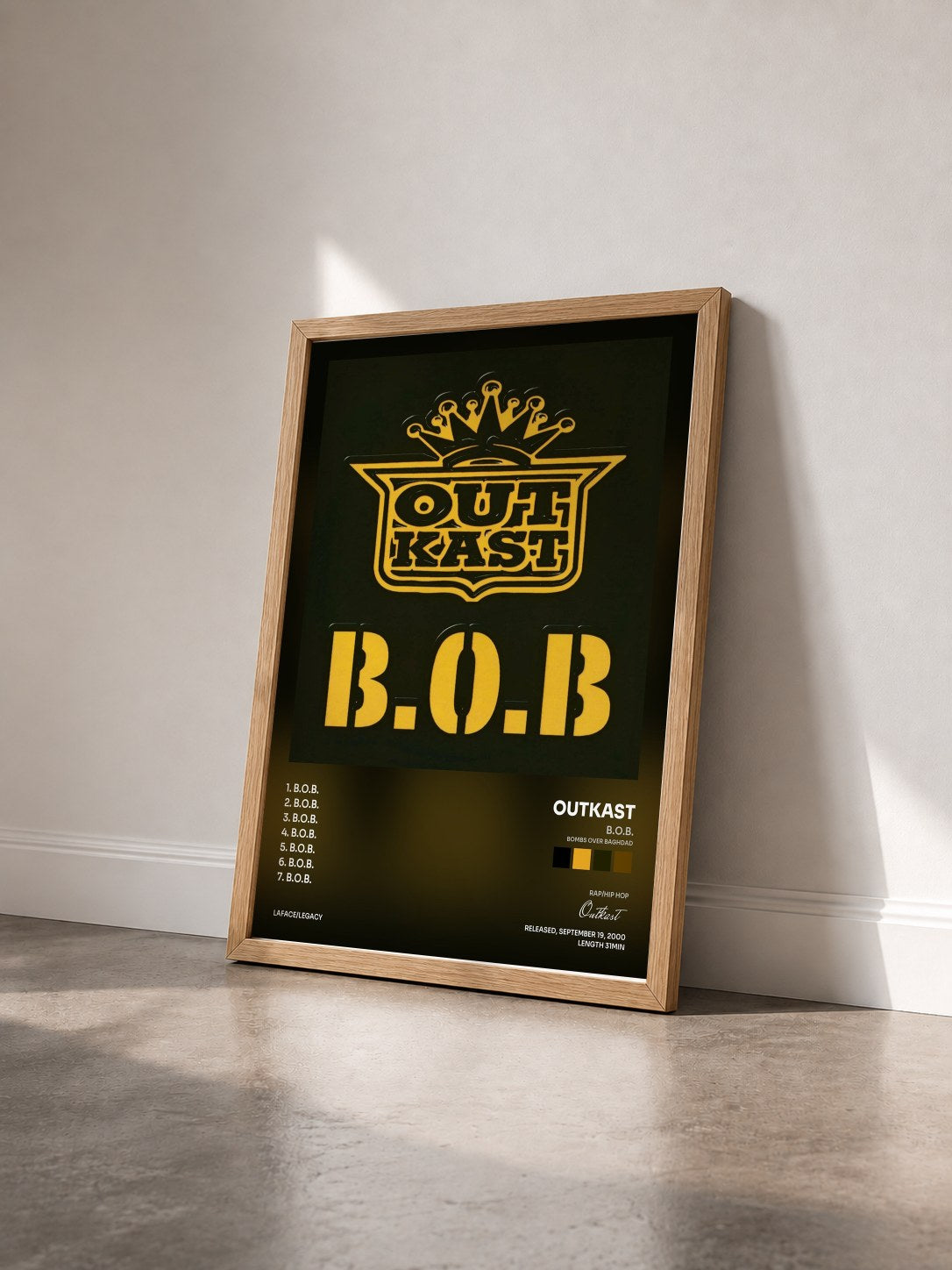 #bois Tableau de l'album B.O.B. (Bombs Over Baghdad) de Outkast vu de trois quarts, cadre en bois brut