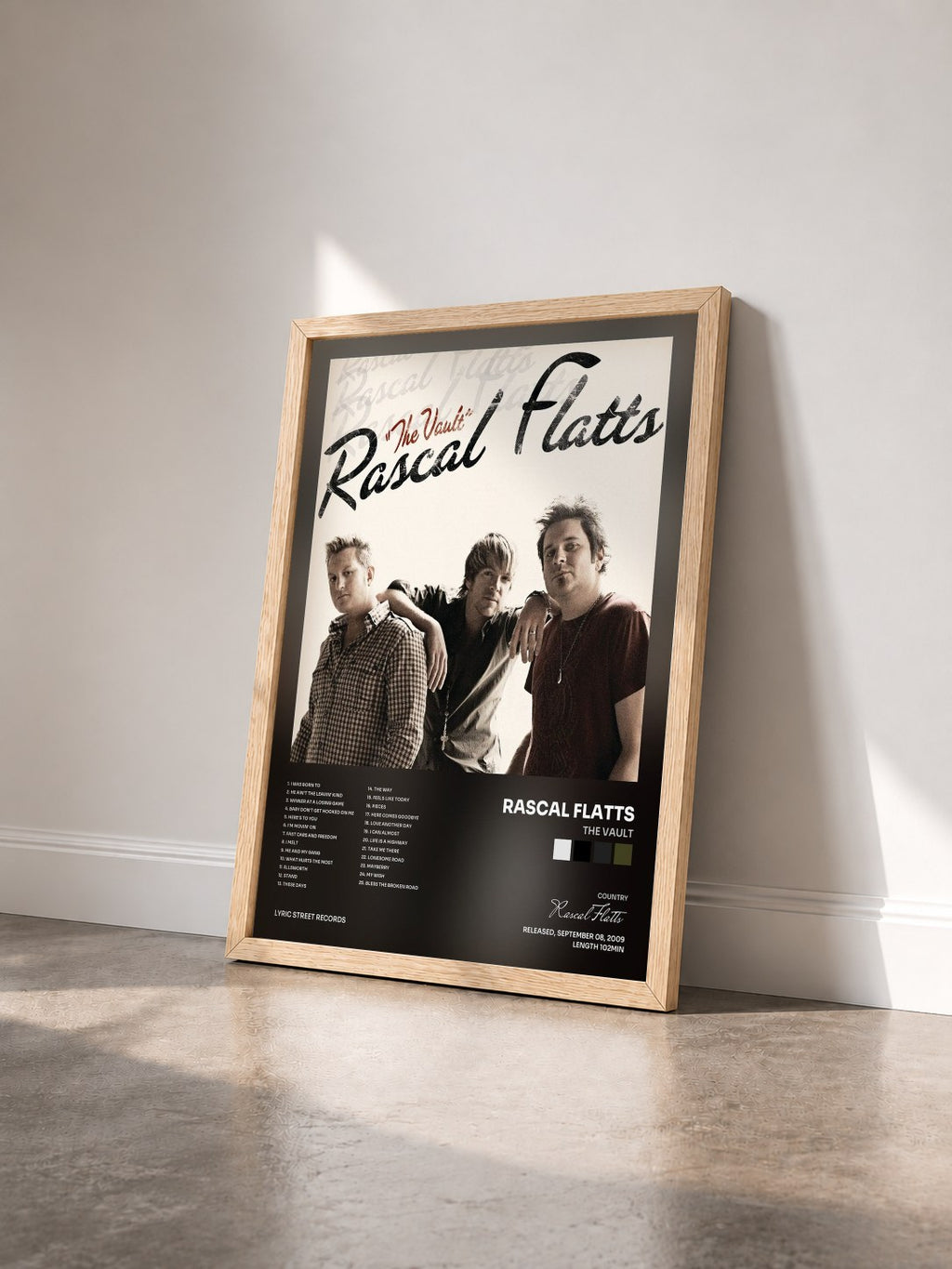 #bois Tableau de l'album The Vault de Rascal Flatts vu de trois quarts, cadre en bois brut