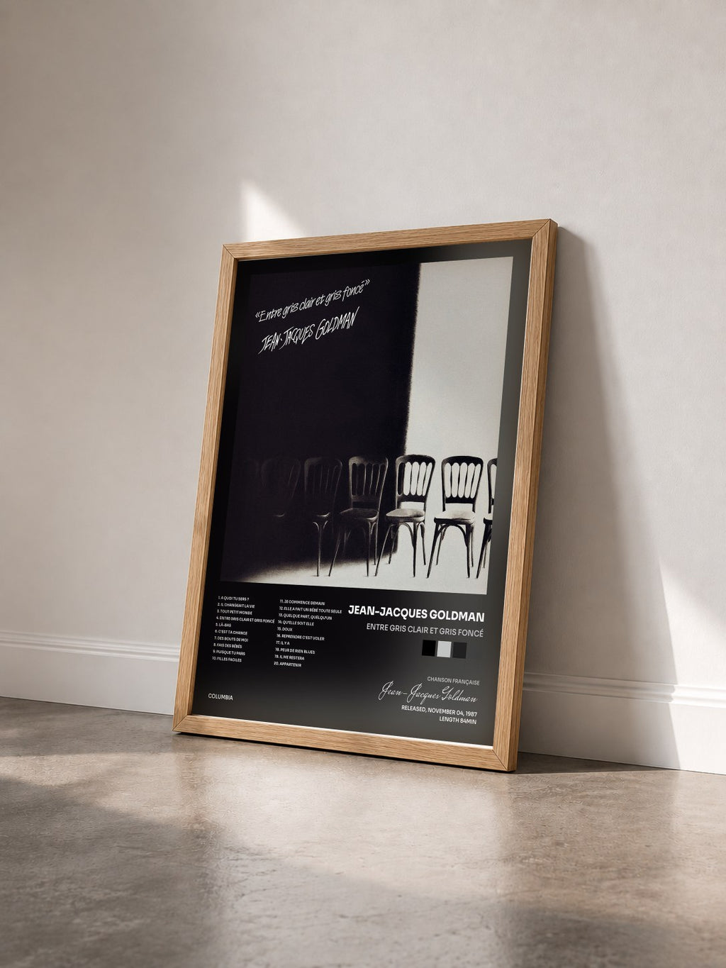 #bois Tableau de l'album Entre gris clair et gris foncé de Jean-Jacques Goldman vu de trois quarts, cadre en bois brut