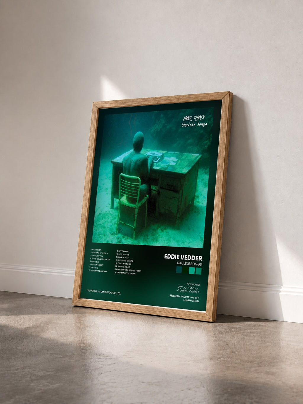 #bois Tableau de l'album Ukulele Songs de Eddie Vedder vu de trois quarts, cadre en bois brut