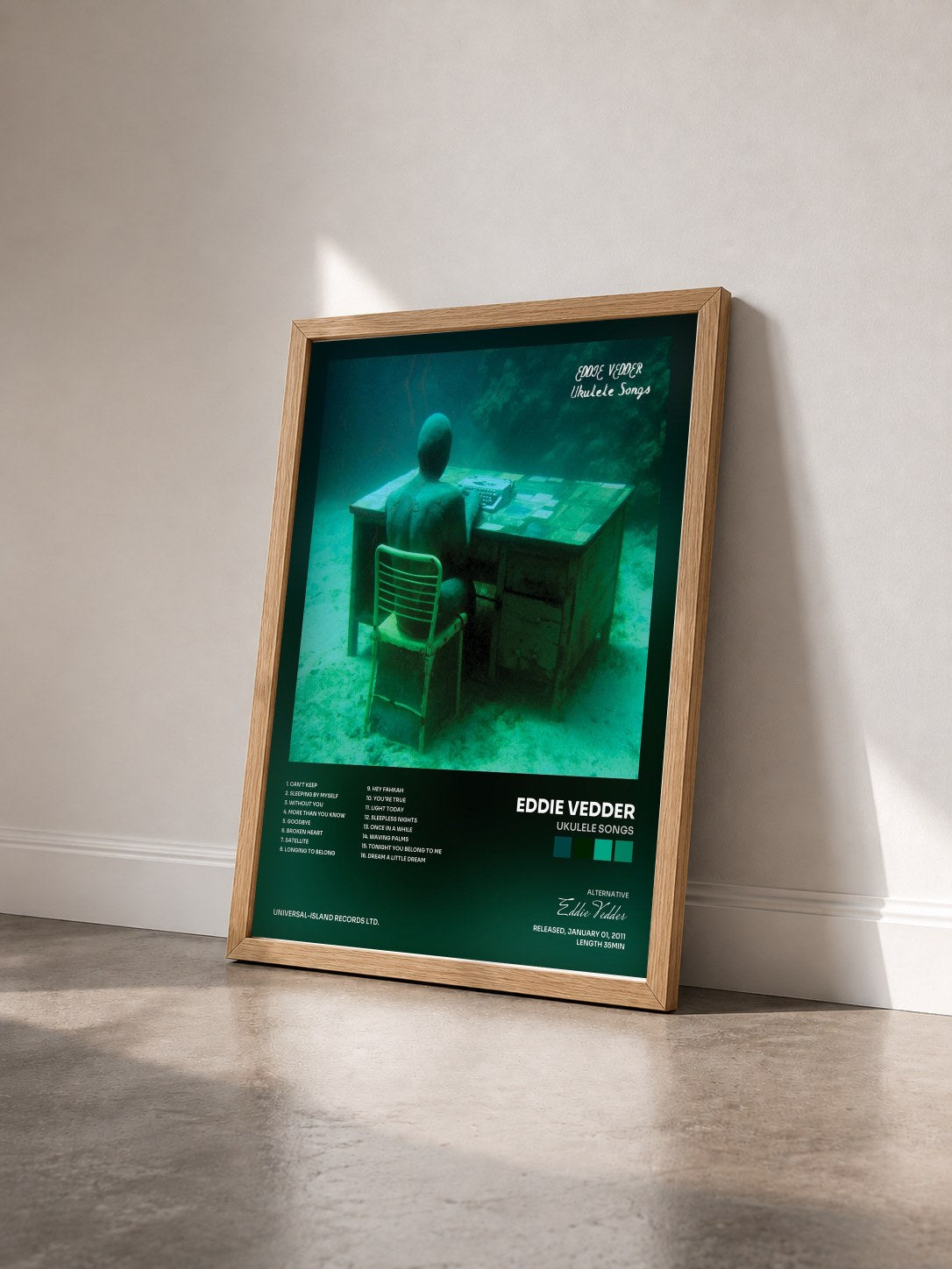 #bois Tableau de l'album Ukulele Songs de Eddie Vedder vu de trois quarts, cadre en bois brut