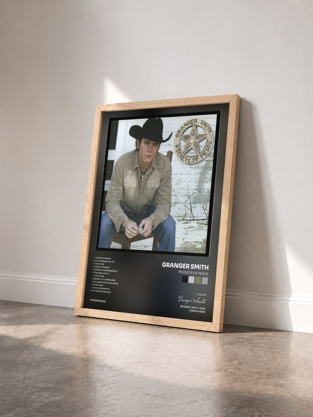 #bois Tableau de l'album Pockets of Pesos de Granger Smith vu de trois quarts, cadre en bois brut