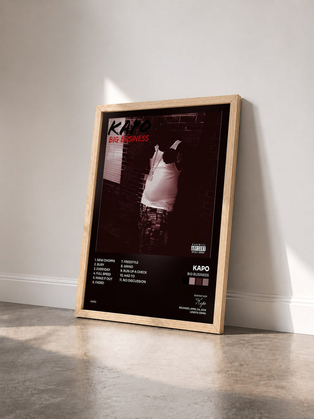 #bois Tableau de l'album Big Business de Kapo vu de trois quarts, cadre en bois brut