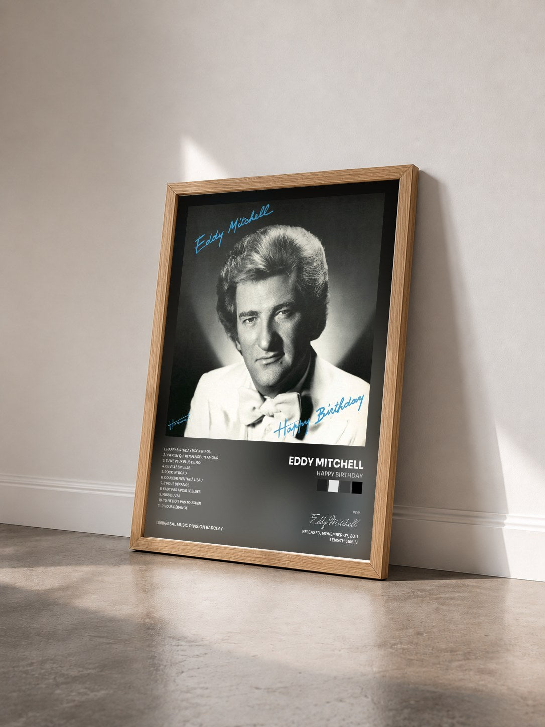 #bois Tableau de l'album Happy Birthday de Eddy Mitchell vu de trois quarts, cadre en bois brut