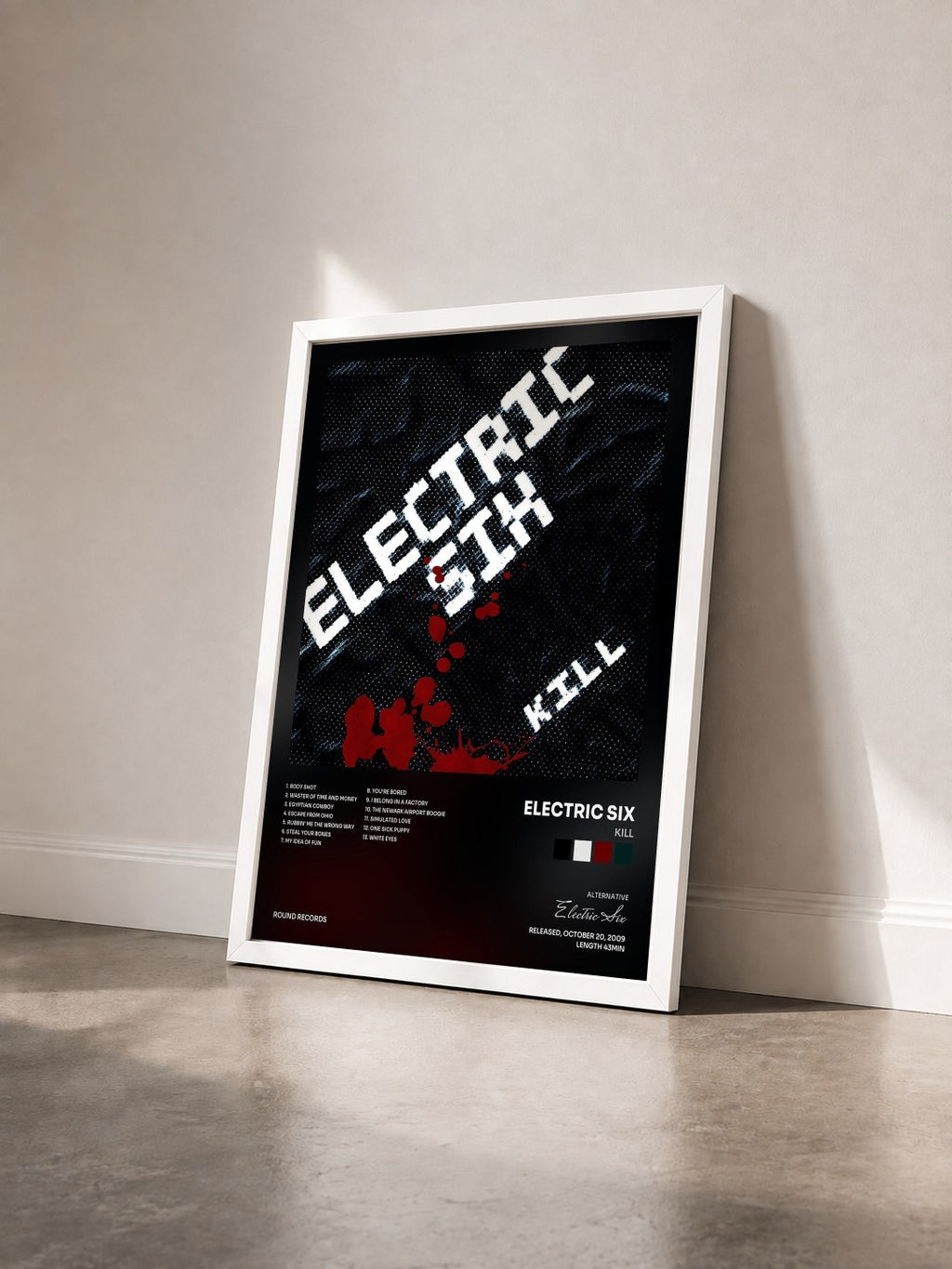#blanc Tableau de l'album Kill de Electric Six vu de trois quarts, cadre blanc