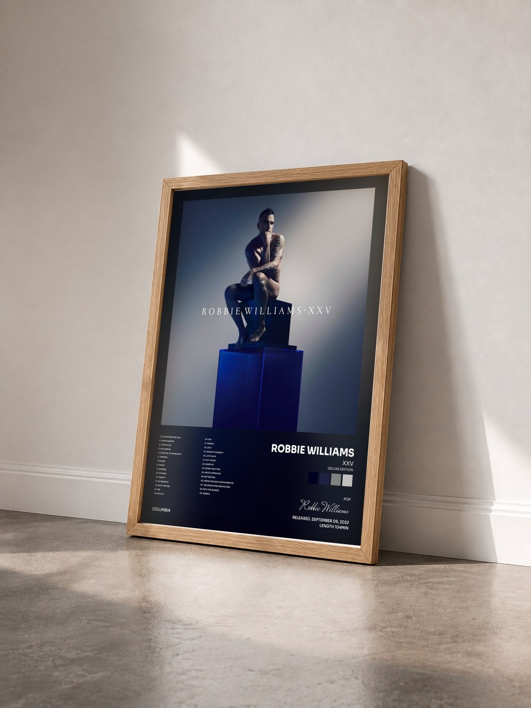 #bois Tableau de l'album XXV (Deluxe Edition) de Robbie Williams vu de trois quarts, cadre en bois brut