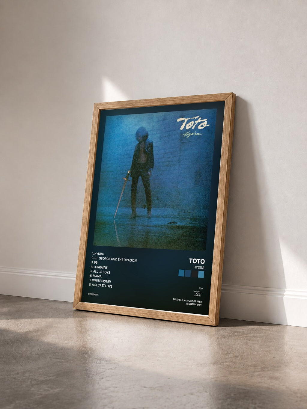 #bois Tableau de l'album Hydra de Toto vu de trois quarts, cadre en bois brut
