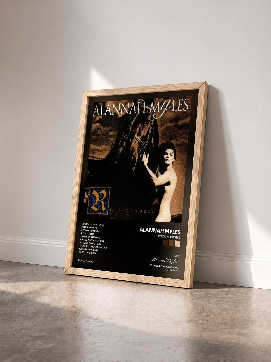 #bois Tableau de l'album Rockinghorse de Alannah Myles vu de trois quarts, cadre en bois brut