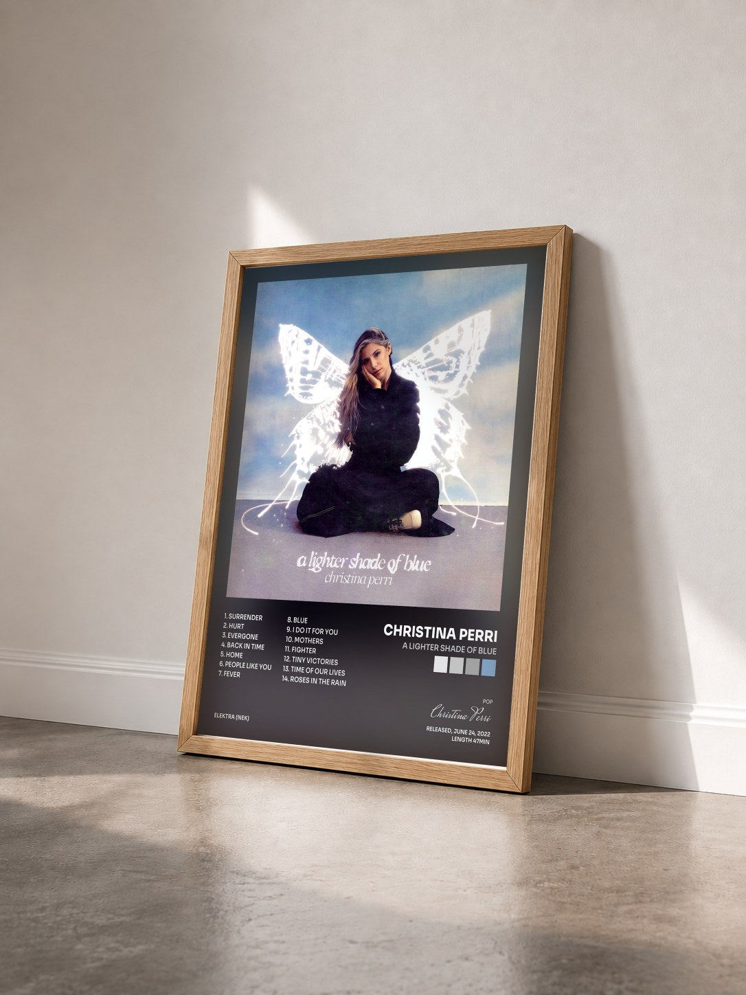 #bois Tableau de l'album a lighter shade of blue de Christina Perri vu de trois quarts, cadre en bois brut