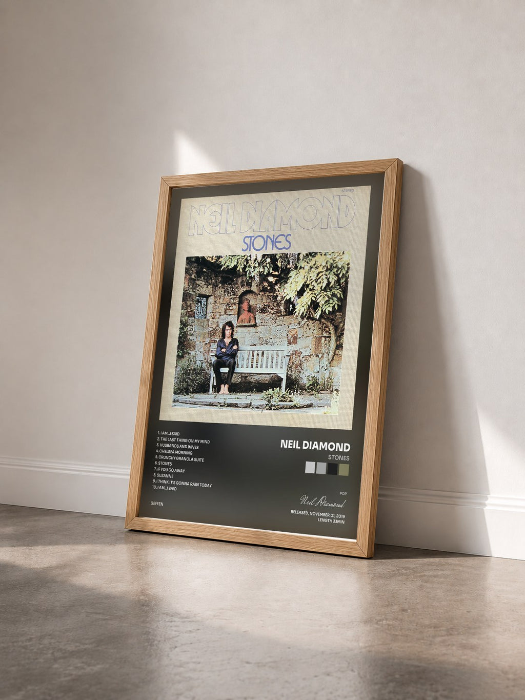 #bois Tableau de l'album Stones de Neil Diamond vu de trois quarts, cadre en bois brut