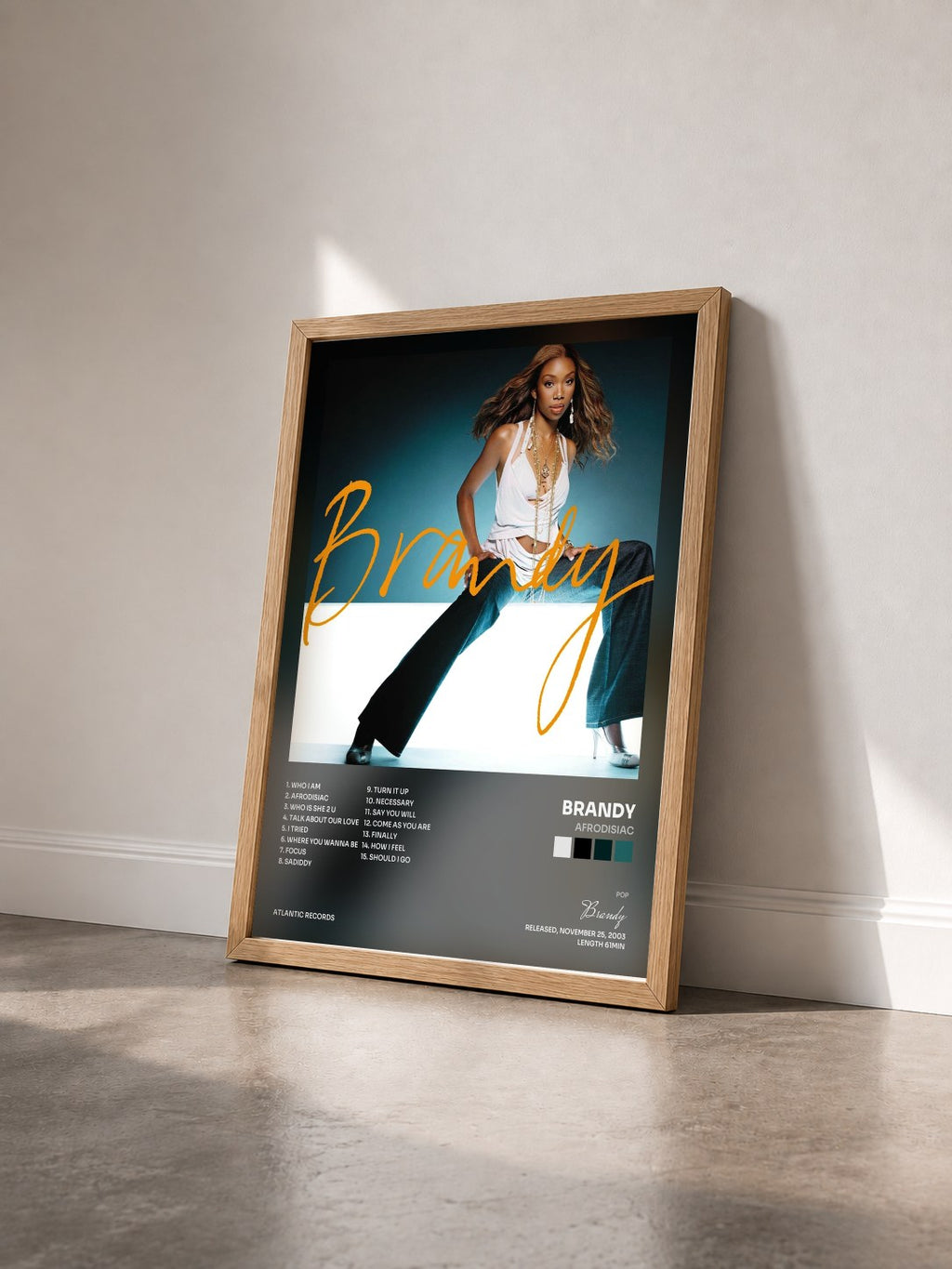 #bois Tableau de l'album Afrodisiac de Brandy vu de trois quarts, cadre en bois brut