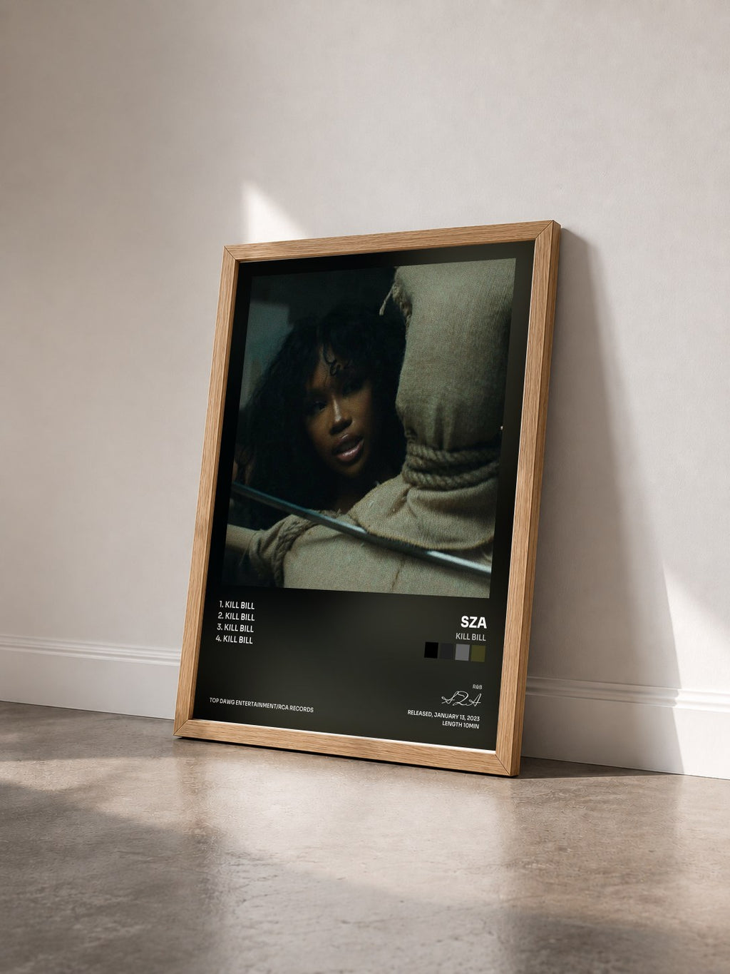 #bois Tableau de l'album Kill Bill de SZA vu de trois quarts, cadre en bois brut