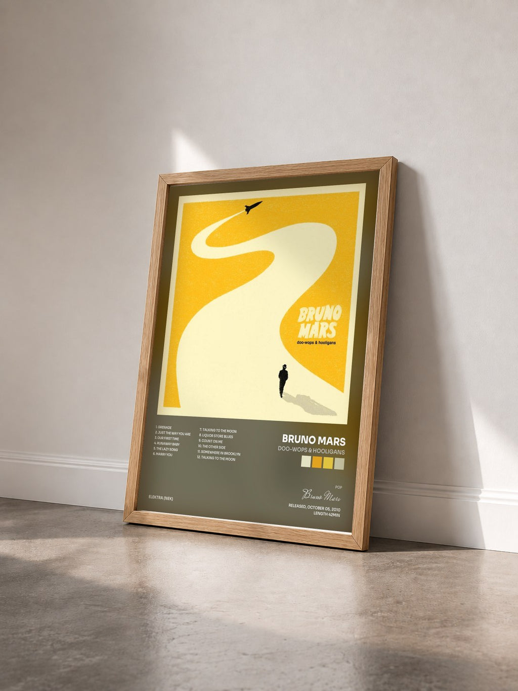 #bois Tableau de l'album Doo-Wops & Hooligans de Bruno Mars vu de trois quarts, cadre en bois brut
