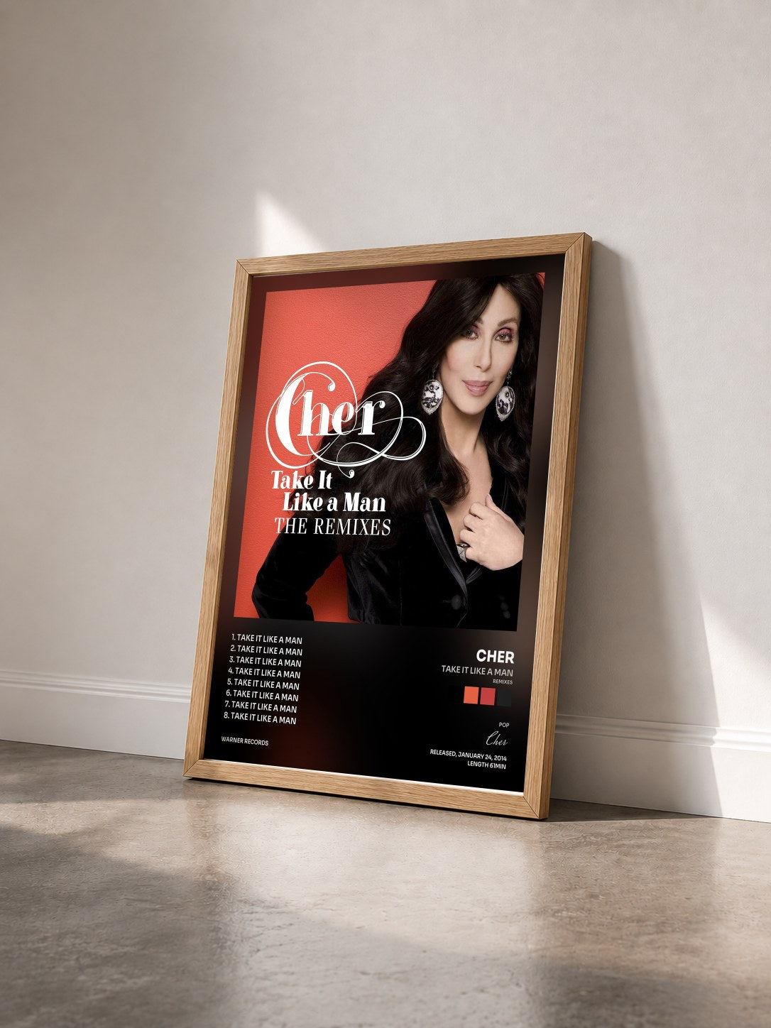 #bois Tableau de l'album Take It Like a Man (Remixes) de Cher vu de trois quarts, cadre en bois brut