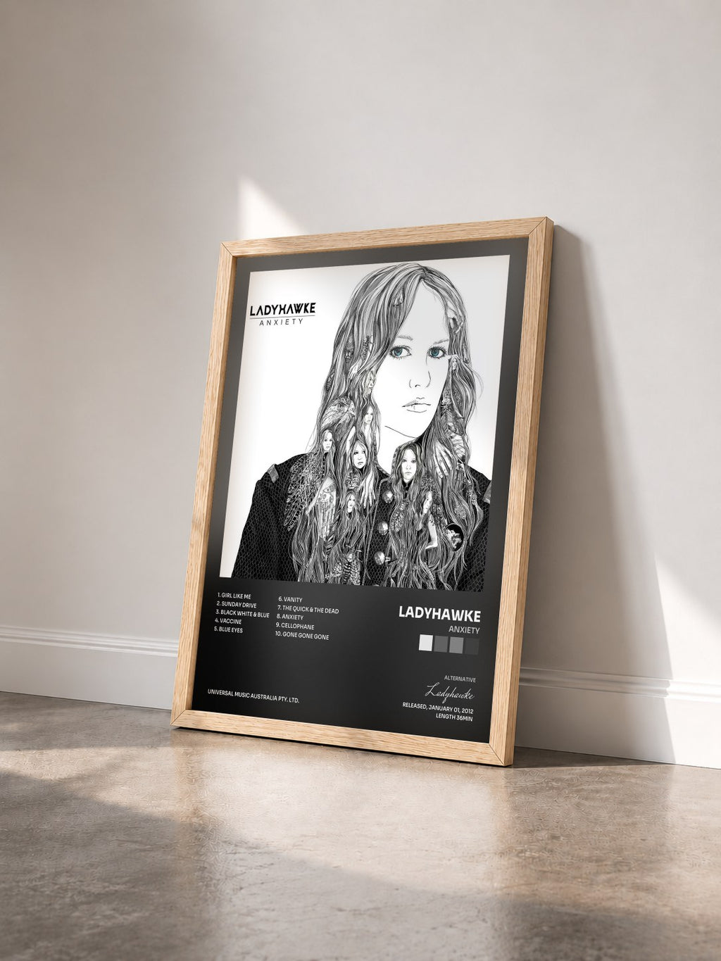#bois Tableau de l'album Anxiety de Ladyhawke vu de trois quarts, cadre en bois brut